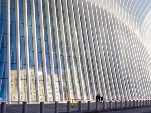 3 people walking beside oculus