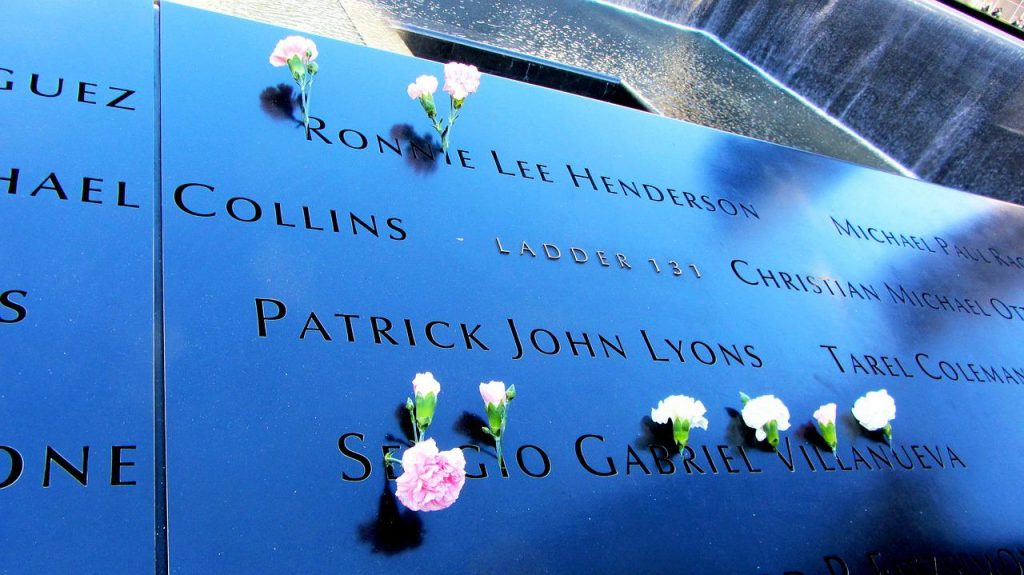 September 11th memorial at Ground Zero with roses next to names